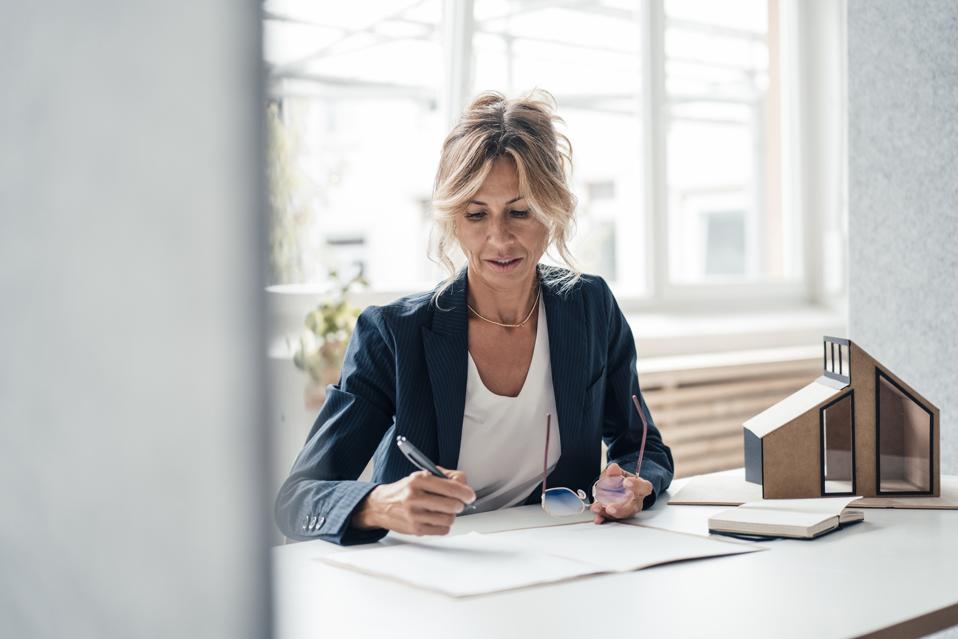 Real estate agent at desk